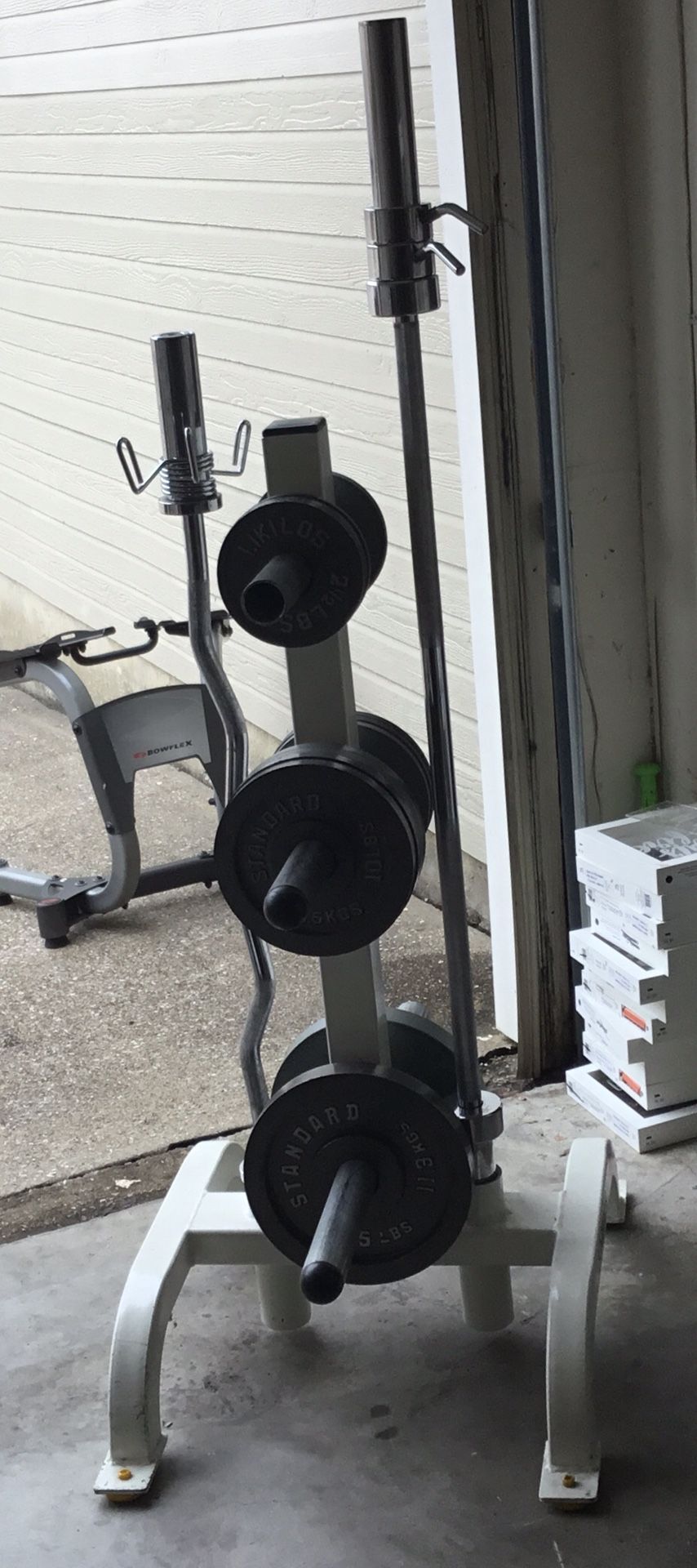 Cybex Plate Tree with Olympic Curl Bar, Shorty 5’ Olympic Bar, and 120lbs of Weight Plates. I’m not selling the plates separately.