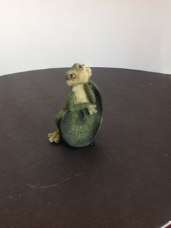 Frog leaning against a Lillypad leaf, daydreaming