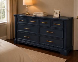 Navy blue dresser with gold accents