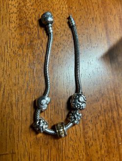 7.5” Pandora bracelet with 5 Pandora charms