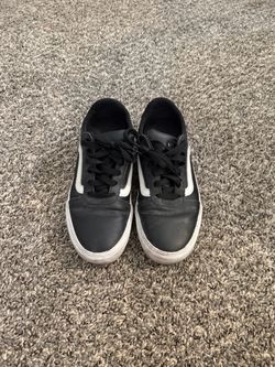 Black Vans sneakers with white stripe, size US 9.0