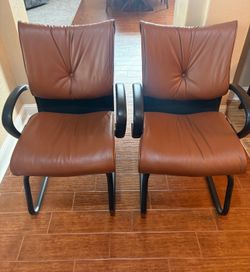 Two Leather Chairs