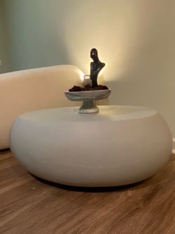 Egg shaped coffee table ottoman