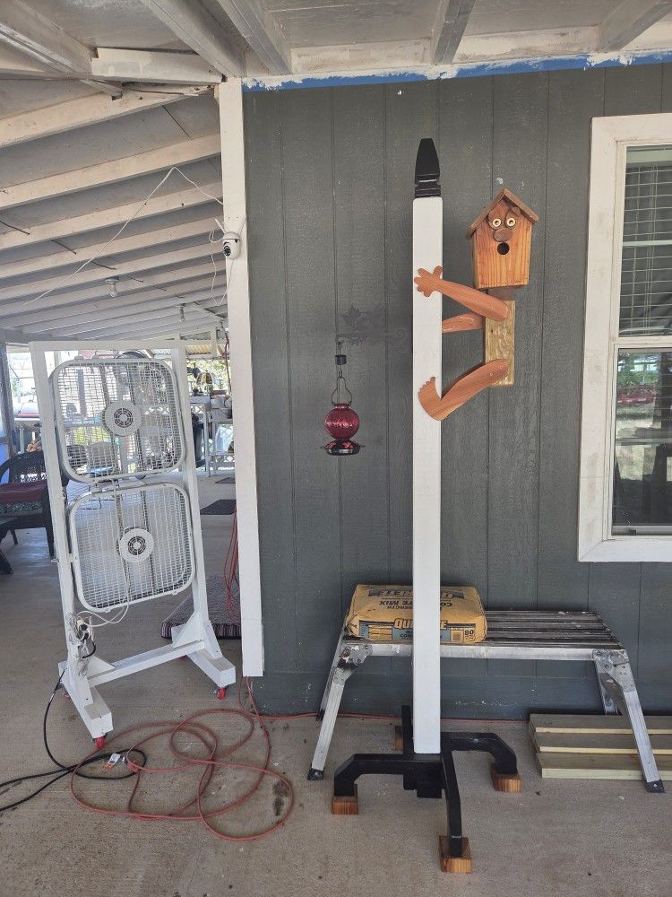 Bird House With Hummingbird Feeder On Post