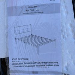 This is a Tiwn size a modern metal bed frame featuring a tufted, upholstered headboard and a metal slat support system; the upholstered headboard is g
