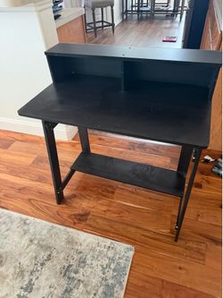 Desk and rolling chair