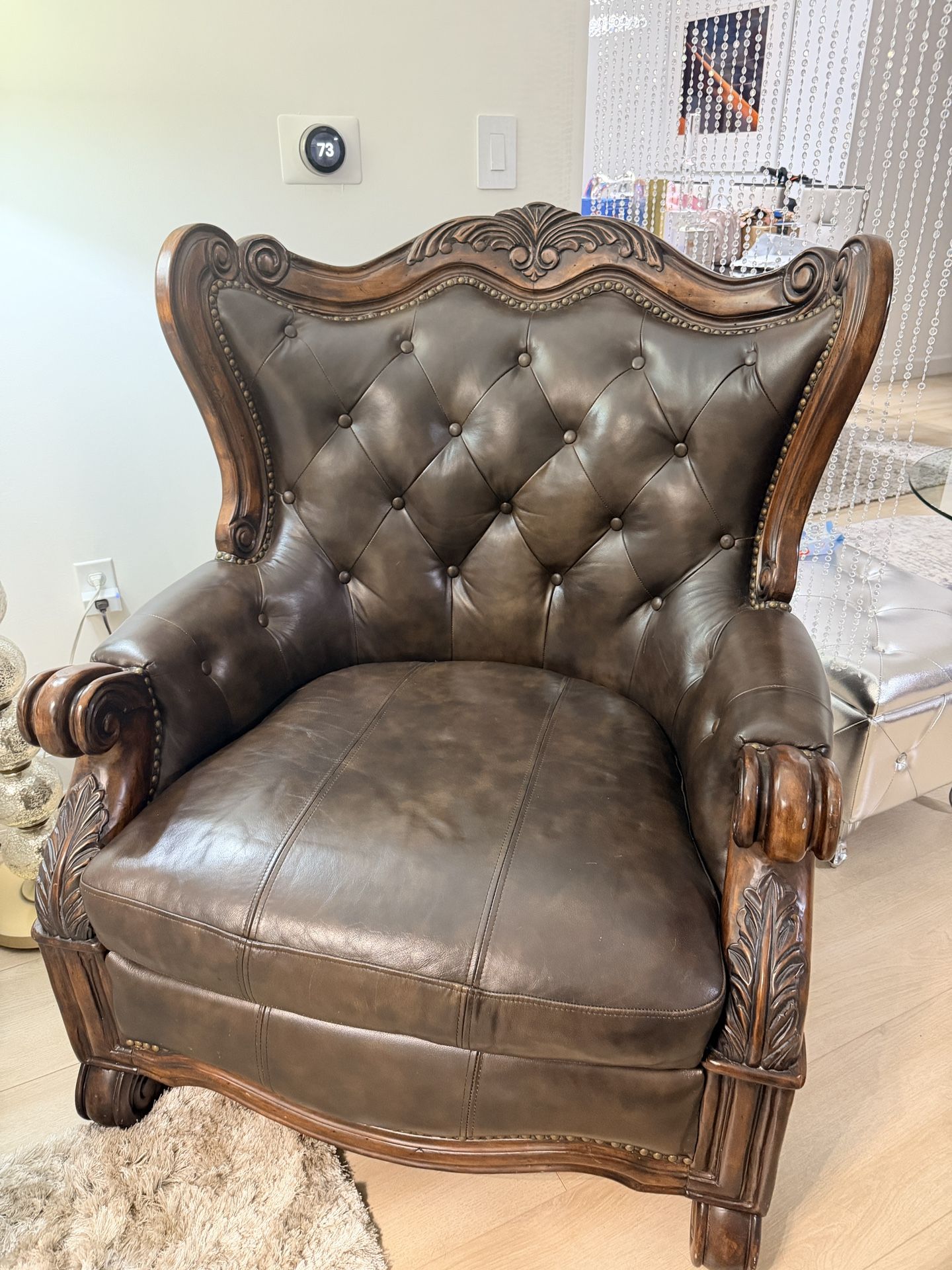 Antique carved oak chair with original leather