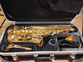 The LJ Hutchen 4217 Eb Alto Saxophone with Case and Music  Stand