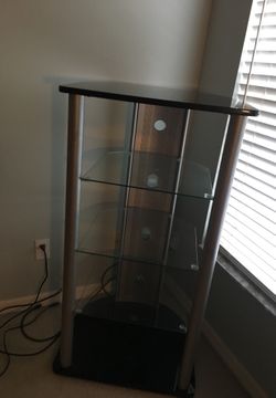 nice glass with chrome stand with4 shelf. 22 inches high