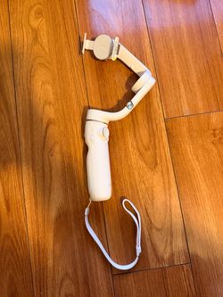 DJI OM 5 smartphone gimbal stabilizer in good working condition.
