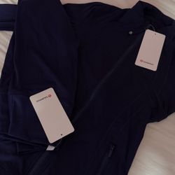 navy blue lululemon set (define jacket with leggings)