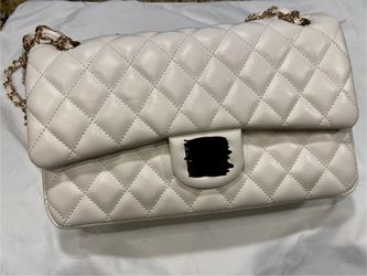 Quilted shoulder purse and gold hardware.