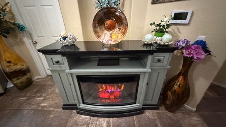 Beautiful and solid fireplace /tv stand in excellent condition 64” inches long