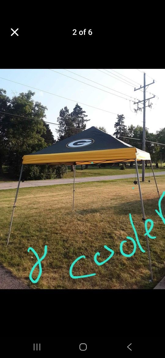 NFL, GREEN BAY PACKERS, Coleman, preowned, 10 x 10 water proof canopy tent w/carrying case, small hole on carrying bag and a new 24 can cooler firm