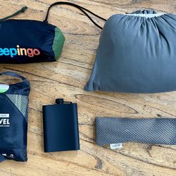 Camping supplies: air mattress, flask, utensil, towel, pillow