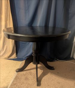 Round solid table - about 34 in diameter x 30 inches height