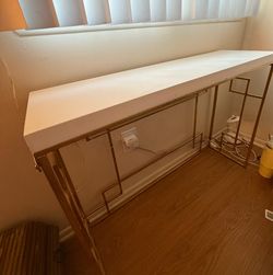 White top table with gold frame