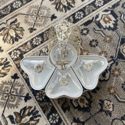 luxury metal and white ceramic divided serving platter designed for snacks, dried fruits, or candies. 