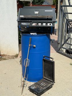 Built in BBQ , side burner , rotisserie and stainless steel grills