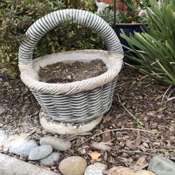 An vintage cement basket