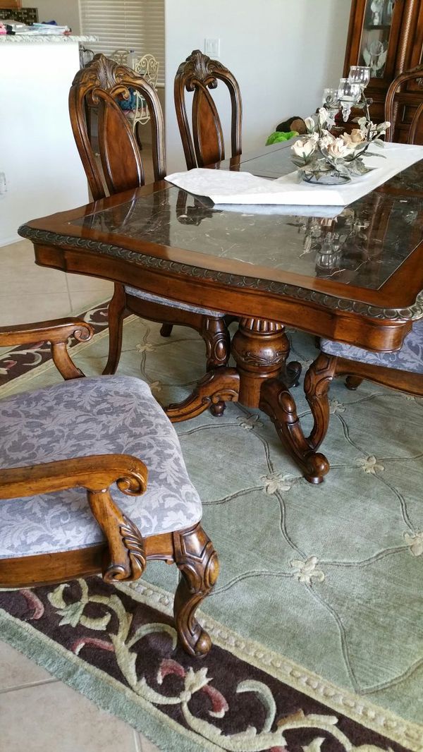 Kathy Ireland Carved Wood Dining Room Table Faux Marble Top Two Kathy Ireland Carved Wood Dining Room Table Faux Marble Top Two Captains Four Side Chairs Grey Fabric Seats 44x84 Nice Condition For In