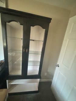 Black hutch with glass shelves