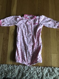 Carter’s brand size 6 month onesie or sleeper with hand protectors to protect the baby from scratching their face.