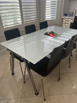 Glass Table With 6 Black Chairs 