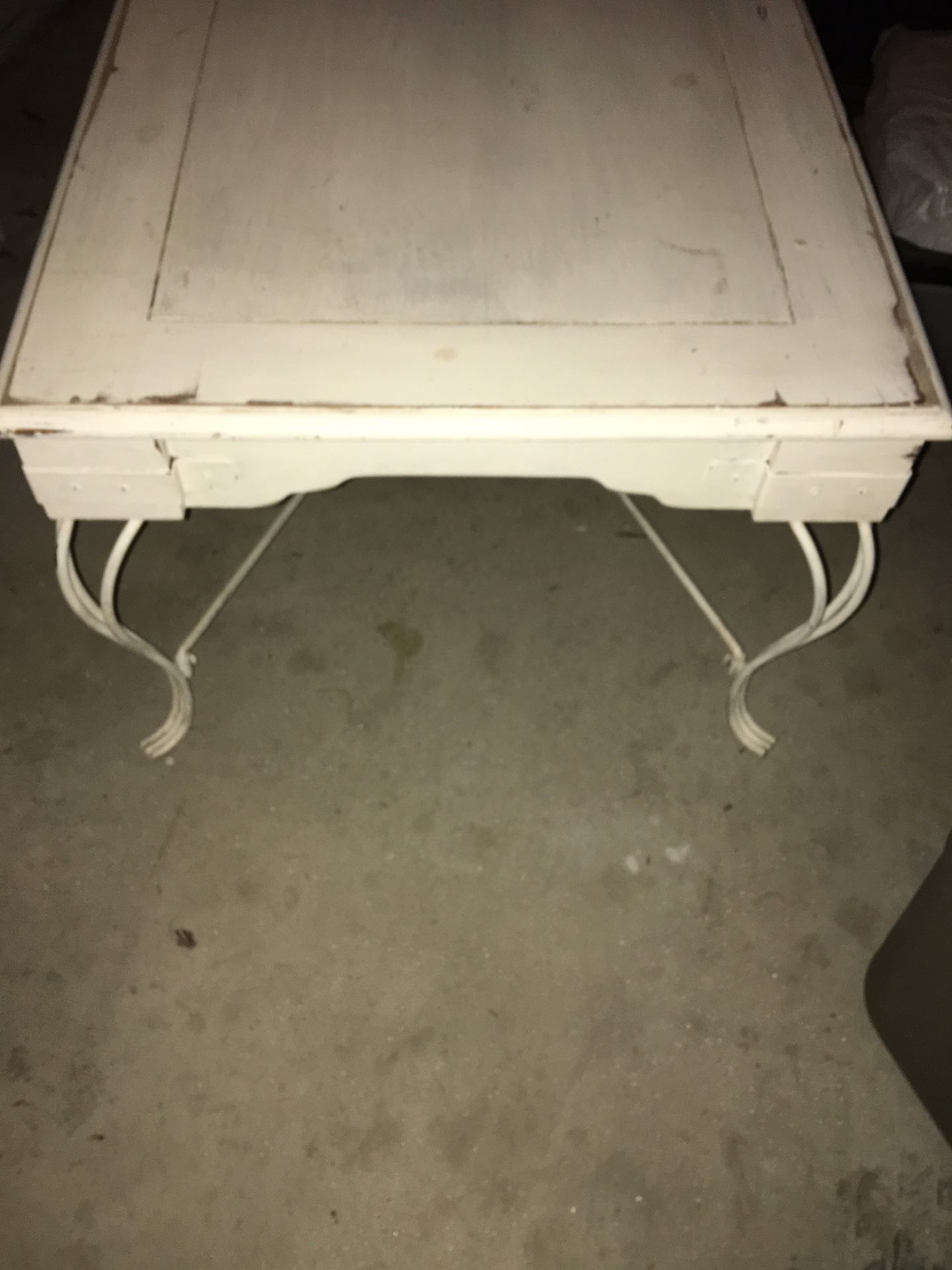 Coffee table with wrought iron legs
