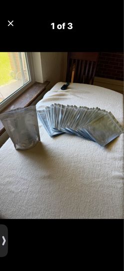 BAGS, 47 silver & clear, 6"w x 9"tall; cross streets are Arapaho & Waterview