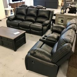 Black reclining sofa and loveseat • Faux leather • Ashley 