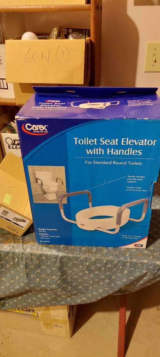 Toilet Seat Elevator With Handles. Brand New. In Original Unopened Box.
