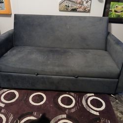 Blue Couch with pull out pop up Bed With USB ports