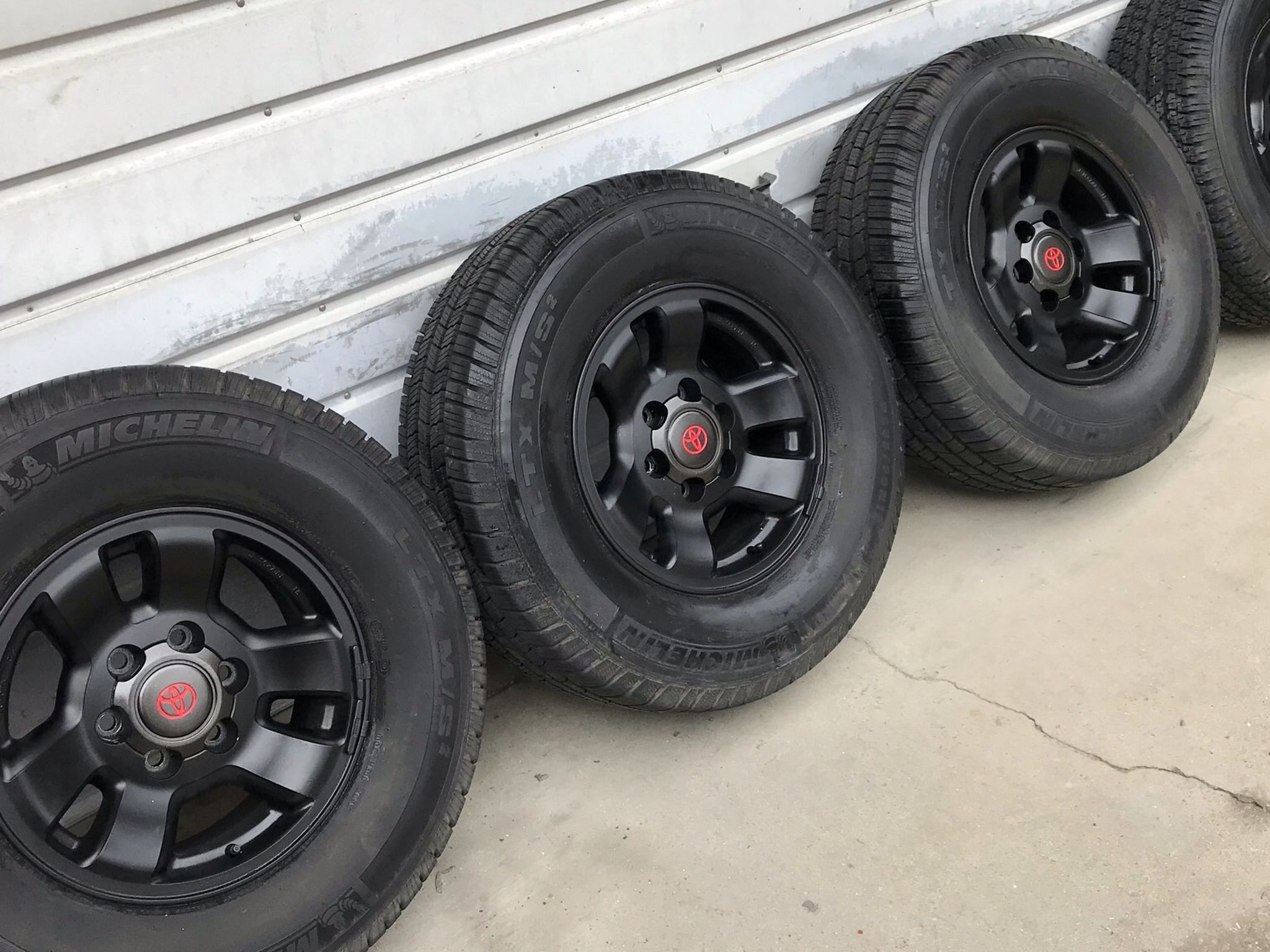 4 Toyota Tacoma Trd Black 16” OEM Rims 6 Lug 3 Michelin LXT @ 90tread 1 Bridgestone 265/70R16 balanced no sensors good Condition $275 in Ontario 9176