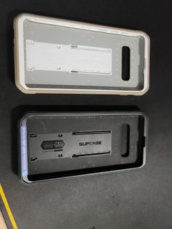Galaxy S10+ Supcase Phone Case. White Is Used And The Black Is Brand New. 