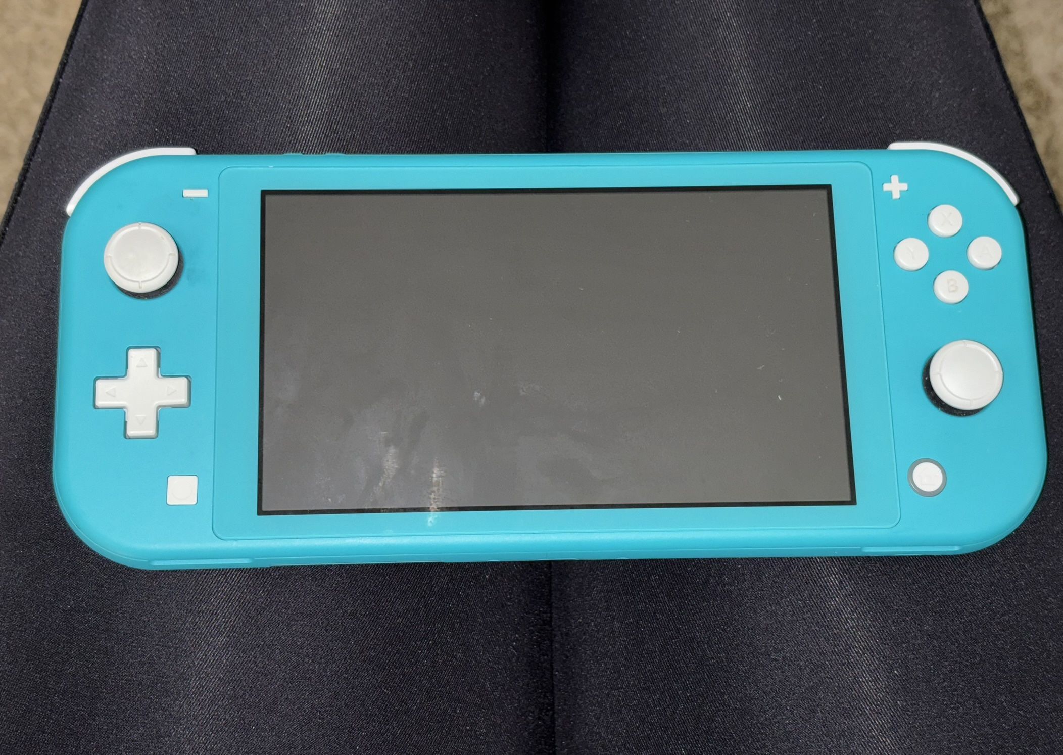 Turquoise Nintendo Switch Lite + Super Mario Bros Game