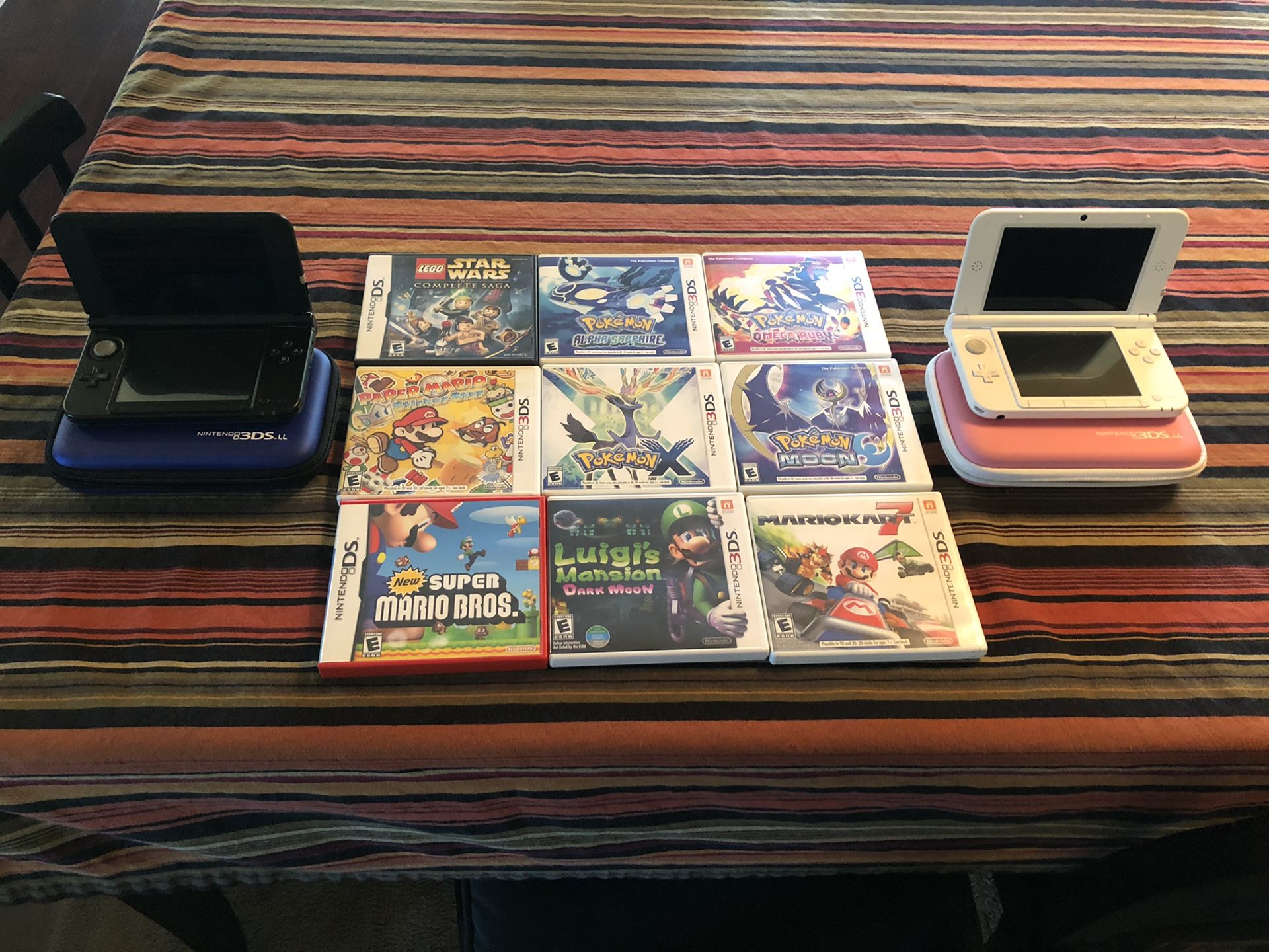 2 Nintendo 3DS XL, Blue & Pink plus 9 games