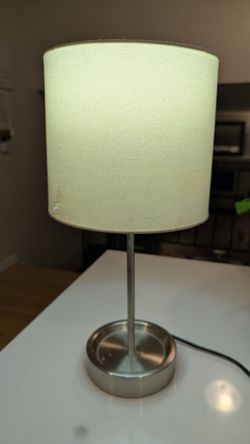 Table top lamp with a white shade