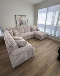 Beige Sectional with pullout sleeper Bed and Storage !