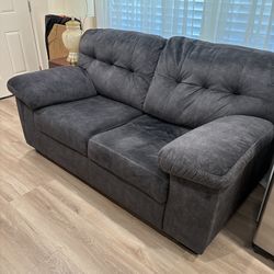 Dark grey love seat/sofa $225