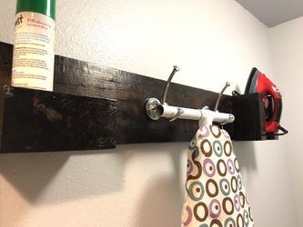Custom made ironing board organizer shelf