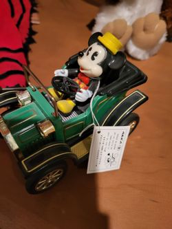 Mickey Mouse wind up Cars from Disneyland work perfect
 The set of three seventy five dollars