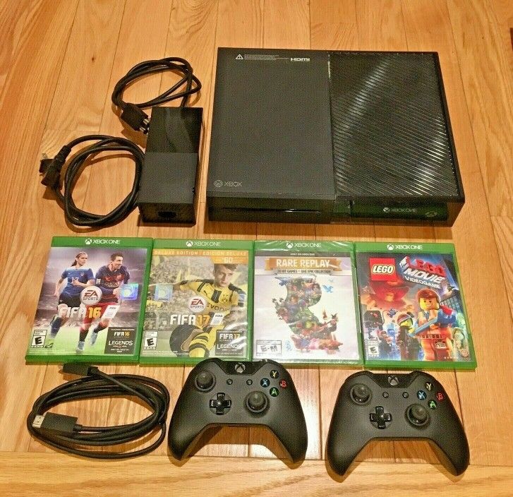 Xbox One with games and cords controllers