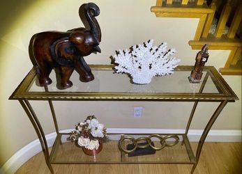 Gold finish display unit with two glass shelves hallway display table. Local pick please.