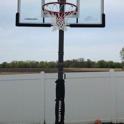 Goaliath 54 inch in ground basketball hoop, adjustable basketball court 