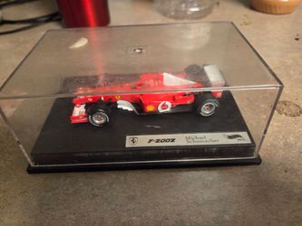 Hot Wheels Racing 1:43 Ferrari F2002 – Michael Schumacher World Champion Diecast F1 Model w/ Case