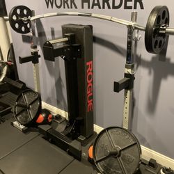 Pair Of Squat Stands And A 7’ Olympic Barbell 
