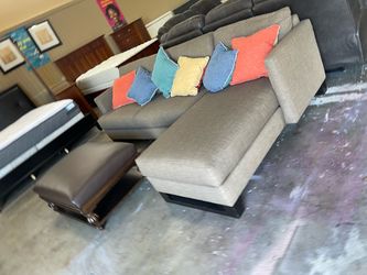 L shape gray sofa with ottoman
