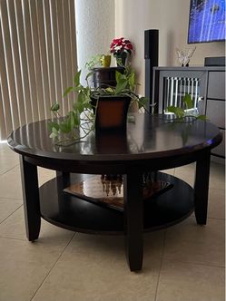Dark Wood Coffee Table with lower shelf and dark wood TV stand with storage drawers .