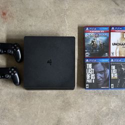 PS4 Slim 1TB with all cords, 2 Controllers, And 4 Games